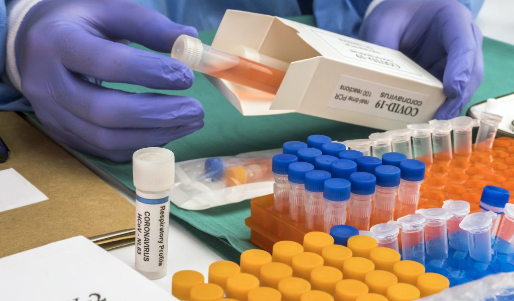 unpacking vaccines to show they are within transporting standards